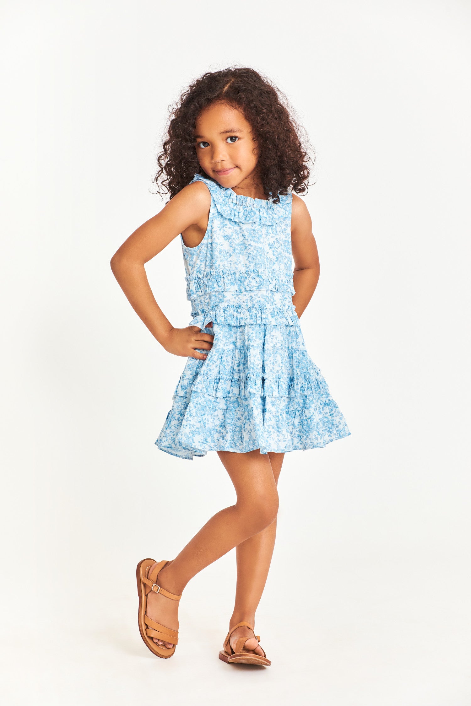 Model wearing kids blue sleeveless mini dress