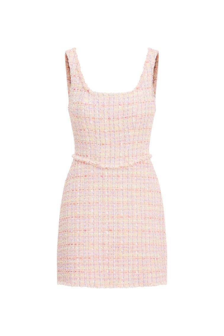 Pink tweed mini dress featuring a scoop neckline, a mod fit that hugs the body then slightly flows out as it descends to a slightly A-line skirt. A deep open back is highlighted by a bow detail.