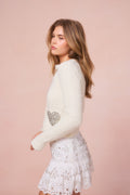 Cream wool-blend cardigan with heart sequin pocket detail, button front, long sleeves