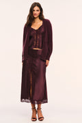 Deep plum satin cami with lace straps, lace v-neckline and lace front details, and button front closures, front view, styled with a matching skirt and fuzzy cardigan