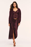 Merlot fuzzy cardigan worn open with button front, long sleeves, and patch pockets