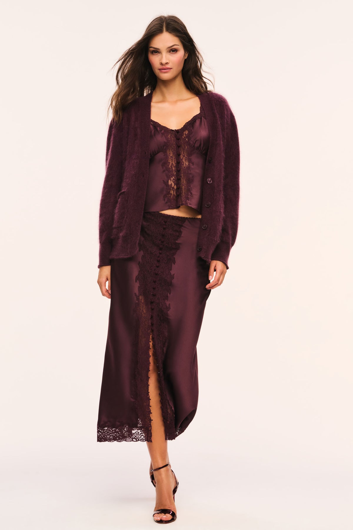 Merlot fuzzy cardigan worn open with button front, long sleeves, and patch pockets