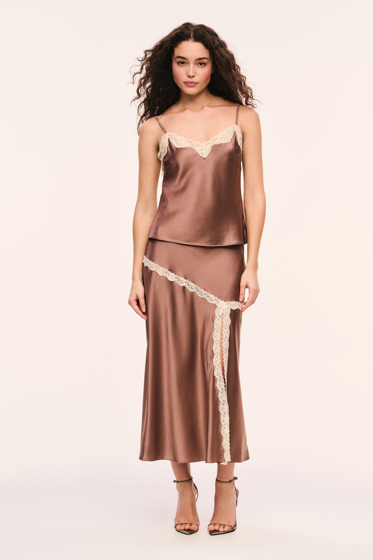 Mocha satin slip skirt with cream lace trim around the hips and vertical trim on edge of the front slit
