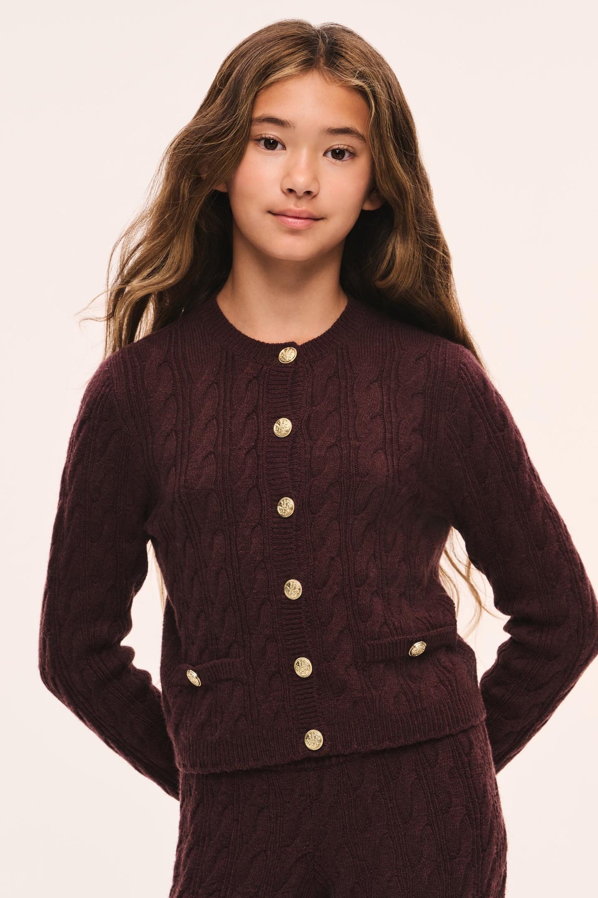 Tween Kenderson cable-knit cardigan in dark maroon with gold buttons and side pockets