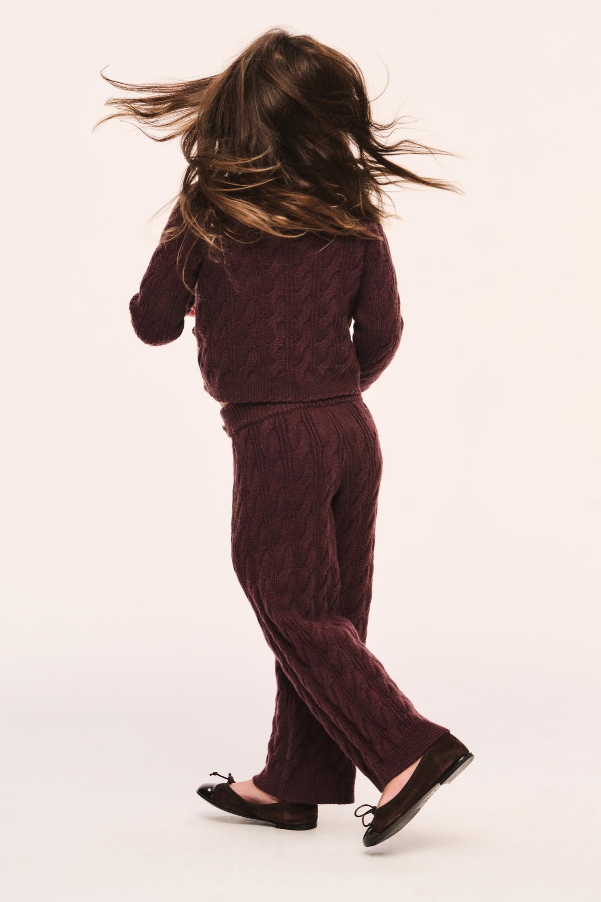 Girls maroon textured wide-leg pants with elastic waist, angled view