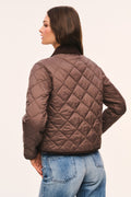 Back view of brown quilted jacket with dark brown corduroy collar and corduroy trim