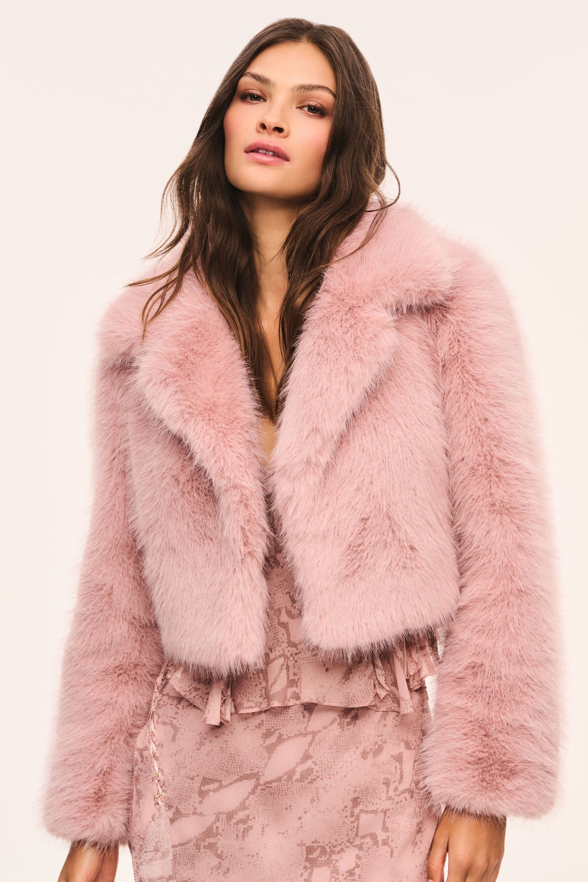 Cropped faux fur jacket with light mauve shag, open front and relaxed dropped shoulders