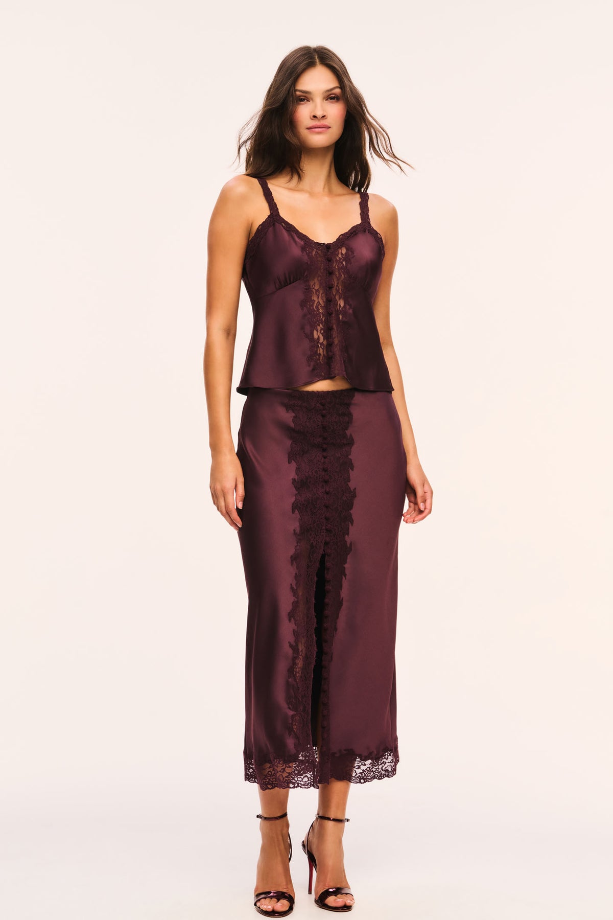 Deep plum satin midi skirt with center lace panel and button closures down the front, front view