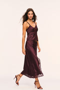 Deep plum satin midi skirt with center lace panel and button closures down the front, side view