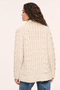 Windel ivory cardigan showing back: textured knit pattern, long sleeves, shawl collar