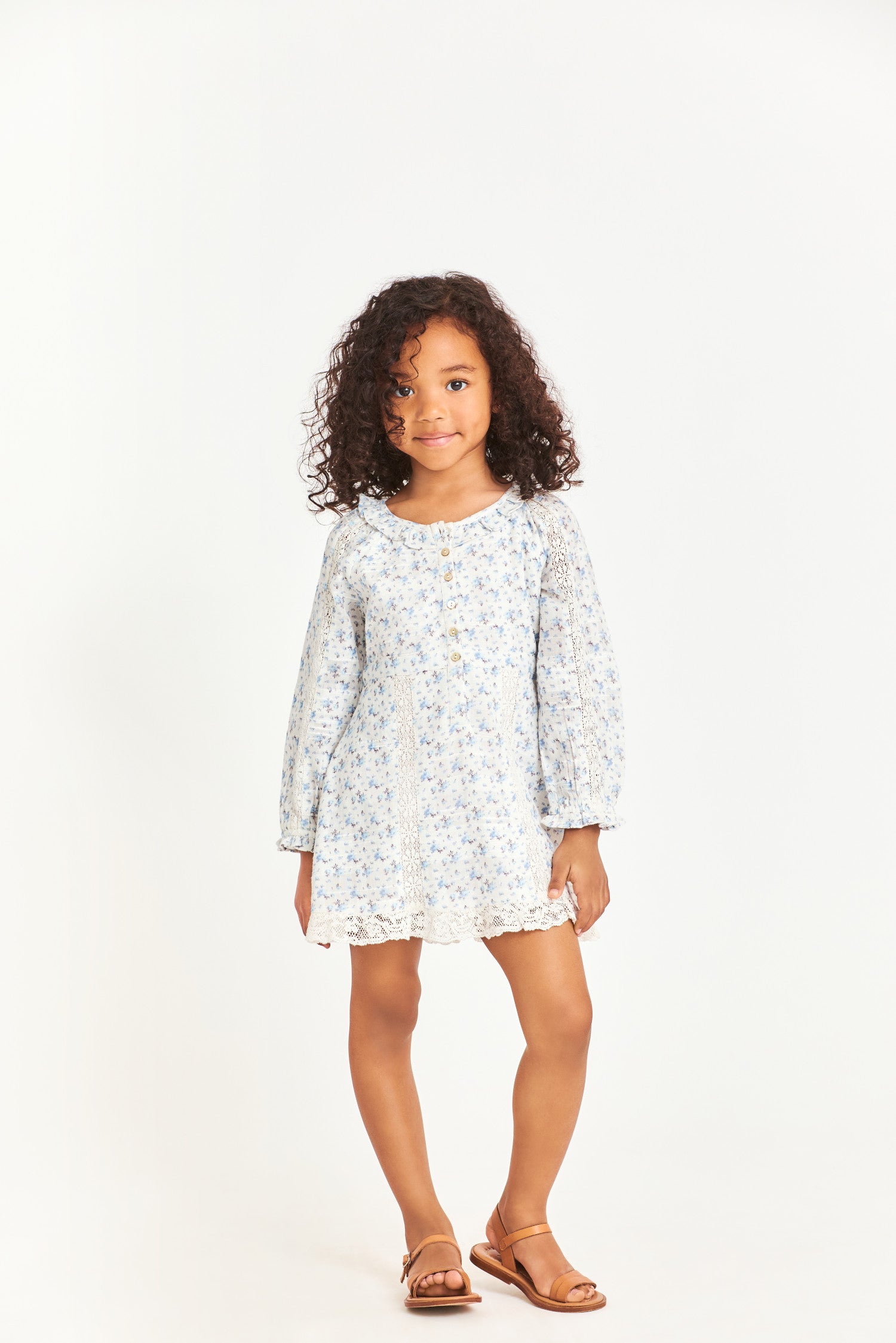 Model wearing kids blue long sleeve mini dress