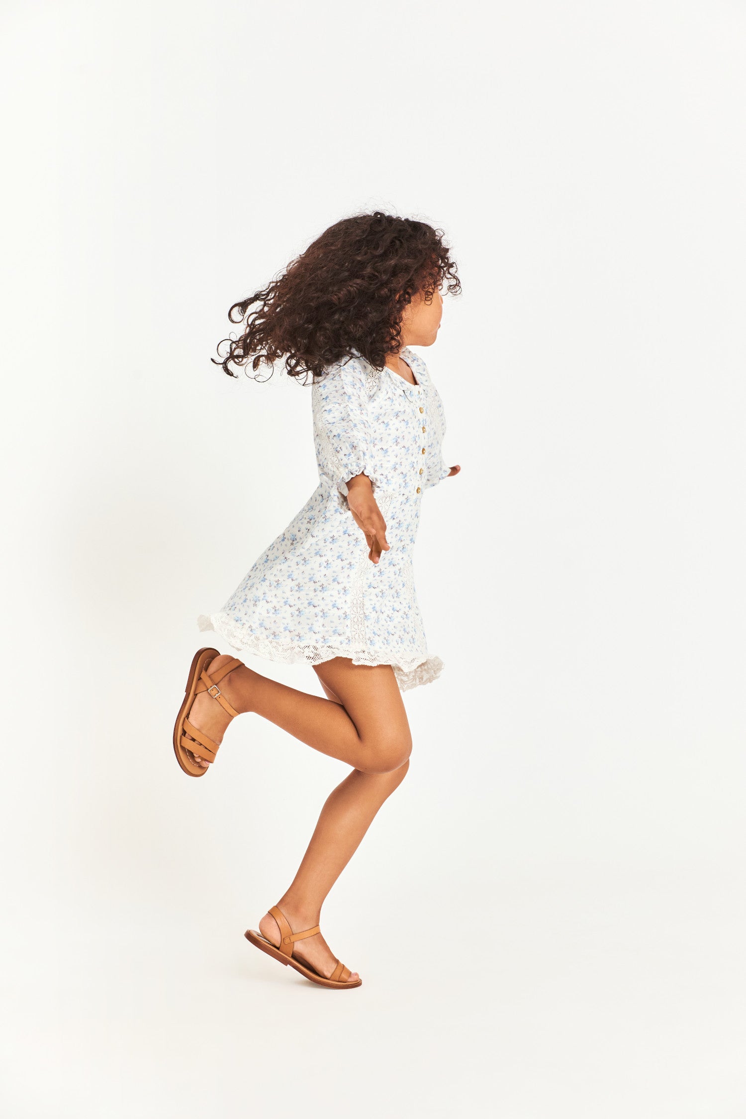 Side image of kids long sleeve blue mini dress