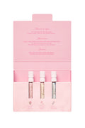 Pink flip-top box open with four mini eau de parfum bottles inside