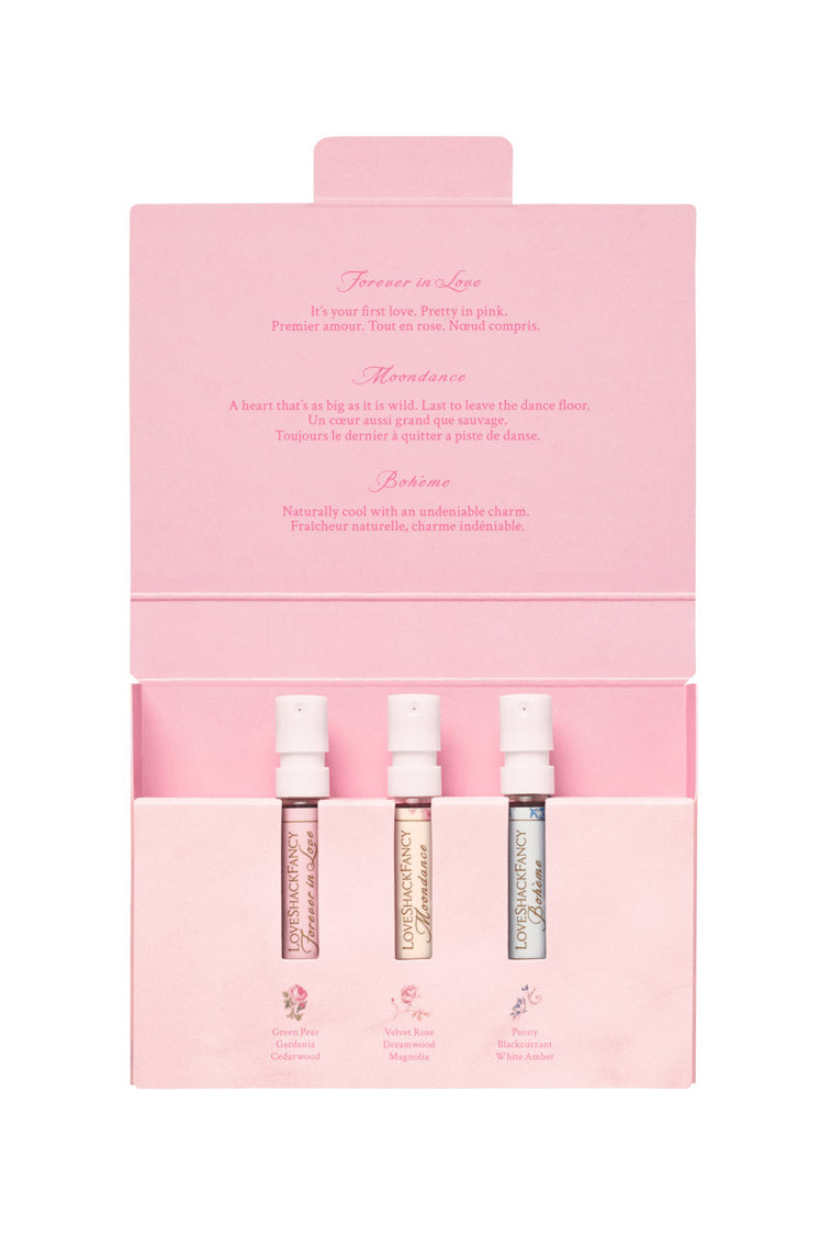 Pink flip-top box open with four mini eau de parfum bottles inside
