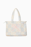 Floral patterned quilted tote bag on a white background