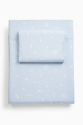 Light blue sheet set stacked with a subtle pattern on a white background