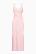 Pink silk gown with lace detailing on a white background