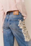 Pink sweater and Blue jeans with floral lace appliqué
