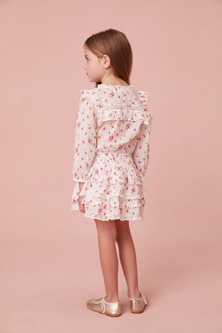 Girls skirt with a floral print and custom-lace embroidered tassels. Below a wide smocked waistband, the skirt falls to two shirred tiers with ruffle details.