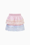 Pastel-colored tiered mini skirt on a white background