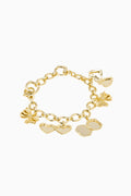 Gold bracelet with heart and bow-shaped charms on a white background