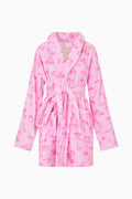 Pink robe with kiss print pattern on a white background