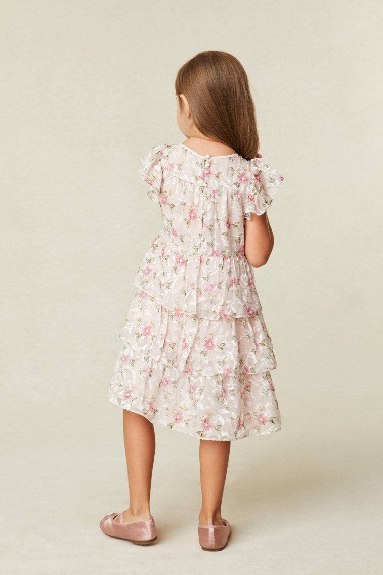 Beautiful Floral Print Dress with Flutter sleeves frame the roomy bodice. An encased elastic waist lets out into a three-tiered ruffle skirt. 