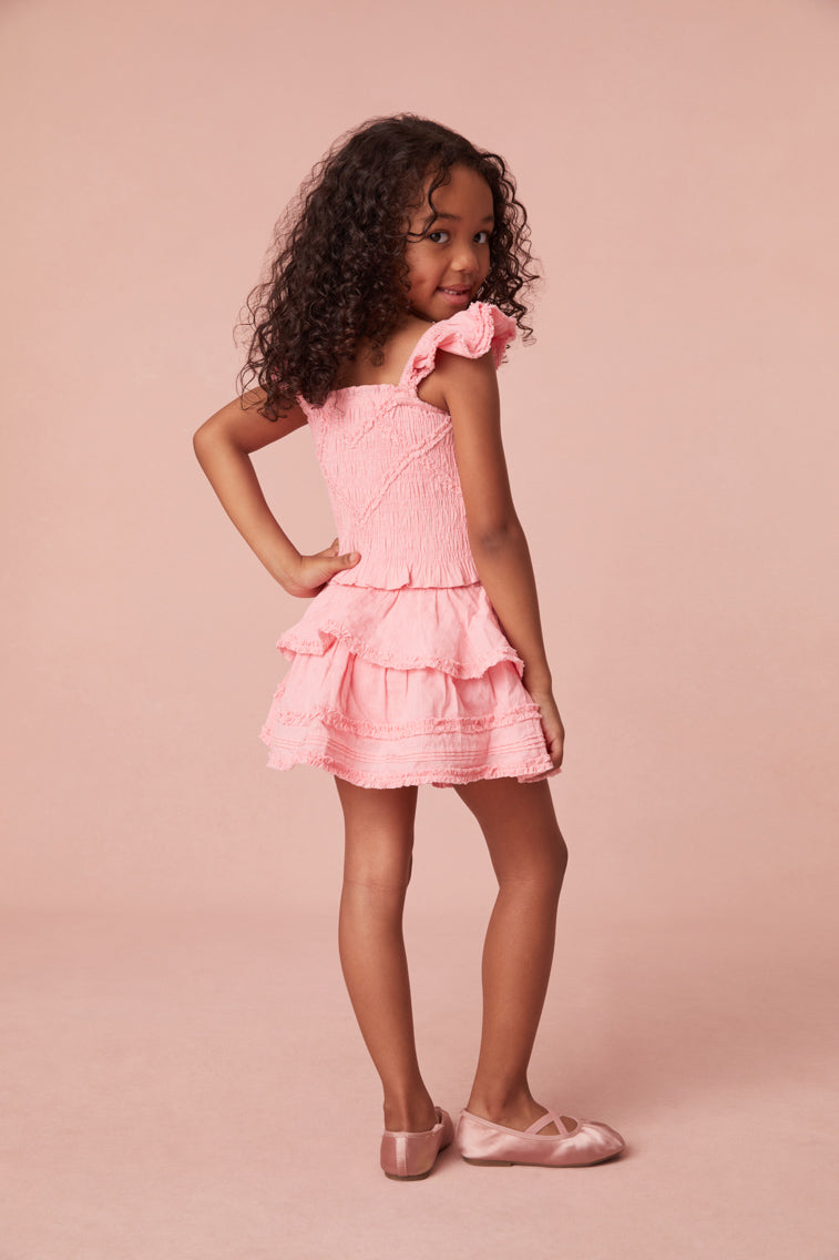 Two-tiered skirt featuring tiny frayed ruffle detailing all over and a frayed hem.