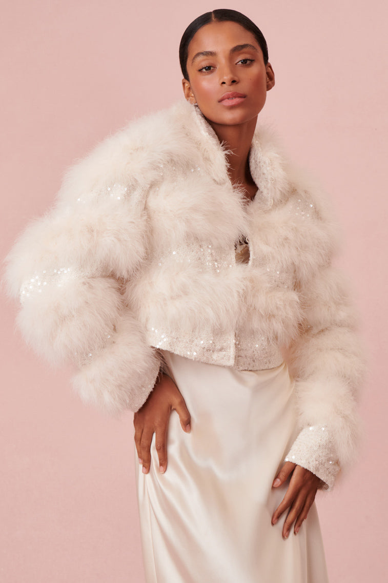 White winter jacket designed with sequin tweed layer of soft feathers