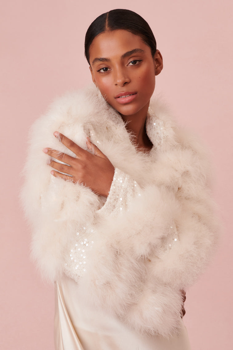 White winter jacket designed with sequin tweed layer of soft feathers