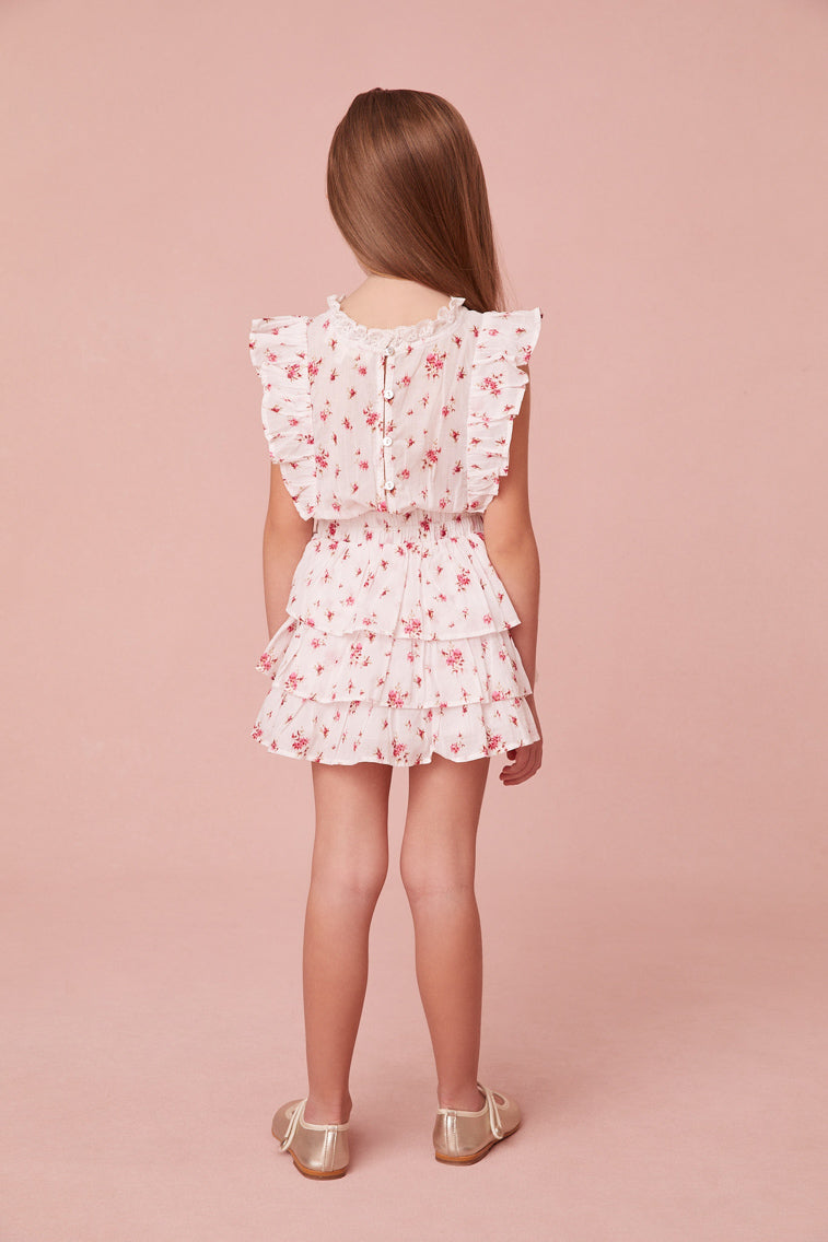 Frock in floral print, has a ruffle-trimmed collar, buttons down center front, flutter sleeves, an elastic waist and overlapping asymmetrical ruffles at the skirt.