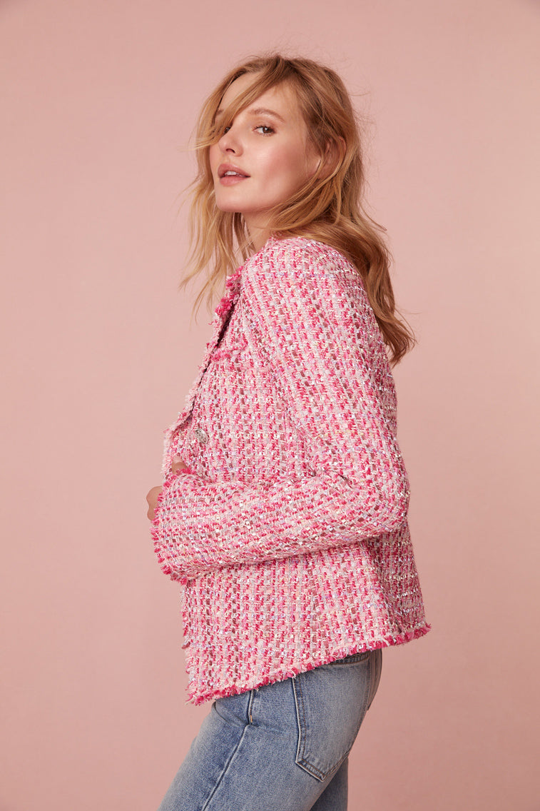 Pink double-breasted, military-inspired blazer sits right at the waist and features custom buttons at center front. Outlined with fringe at edges.