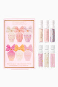 Set of LoveShackFancy perfume bottles with packaging on a white background