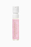 Pink rollerball bottle with white cap on a white background