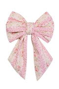 Bow-shaped barette in pink rose print.