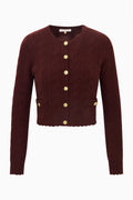 Burgundy cable-knit cardigan with gold button front, patch pockets and long sleeves
