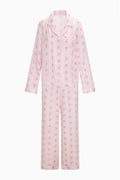 Pink floral pajama set on a white background