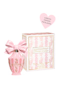 Pink perfume bottle with matching packaging on a white background