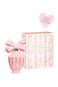 Pink perfume bottle with matching packaging on a white background