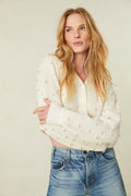 weater features pearl and crystal embellishments all over the front and the long blouson sleeves