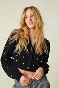 weater features pearl and crystal embellishments all over the front and the long blouson sleeves