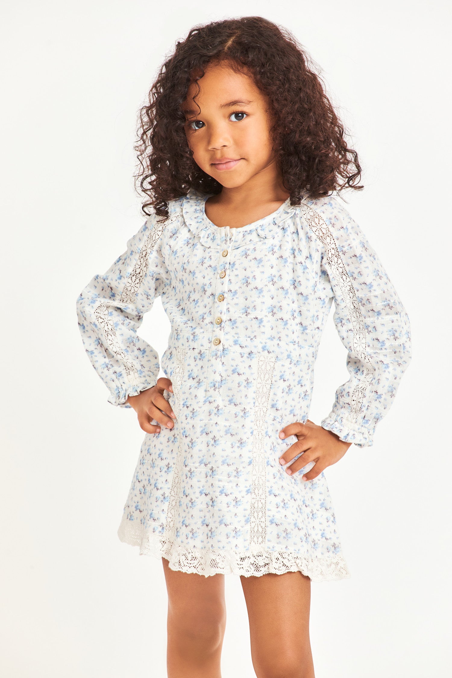Model wearing kids blue long sleeve mini dress