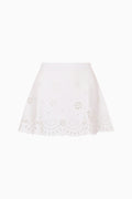 White eyelet detail skirt against plain background