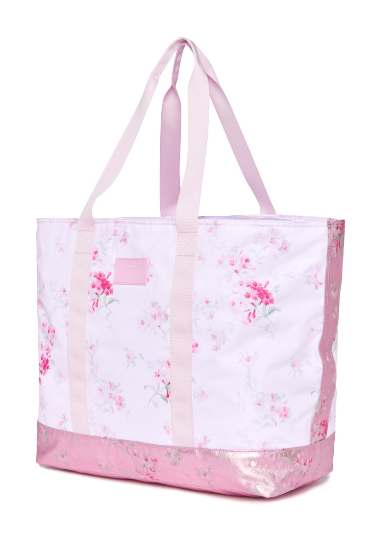 Floral Pink Tote with spacious main compartment and metallic pink trim on bottom. Light pink shoulder handles.