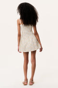 Girl wearing a floral mini dress on a white background