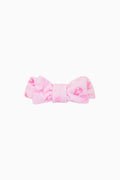 Pink bow on a white background