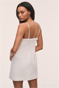 Ivory tweed mini dress back view with lace-trim neckline and thin spaghetti straps