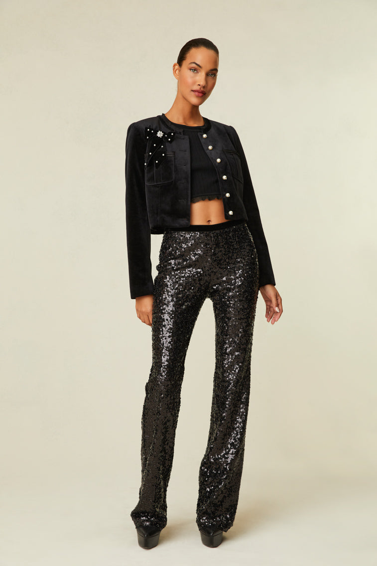 Sequin pants are a straight leg with a mid-rise fit and features a side zipper.