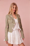 Floral military jacket with pockets on the front and custom gold military buttons at the center. This piece has a 40s-inspired waist with peplum details and princess seams.