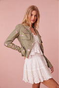 Floral military jacket with pockets on the front and custom gold military buttons at the center. This piece has a 40s-inspired waist with peplum details and princess seams.